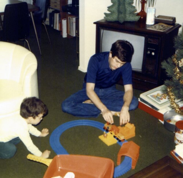 1979-12-25 playing train with Daddy.jpg
