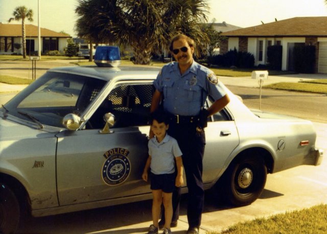 1981-06 Officer Ed Hartman and Bill after ride in Police Car.jpg